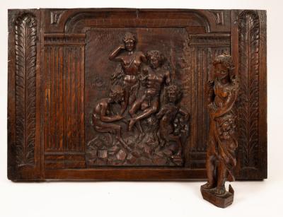 A carved oak panel with allegorical 36b987