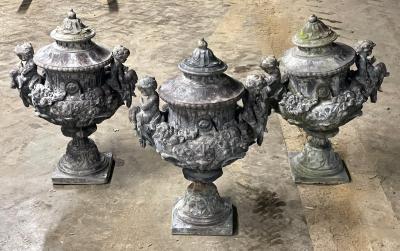 A set of six lead urns, by H Crowther