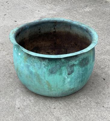 A large verdigris copper planter,