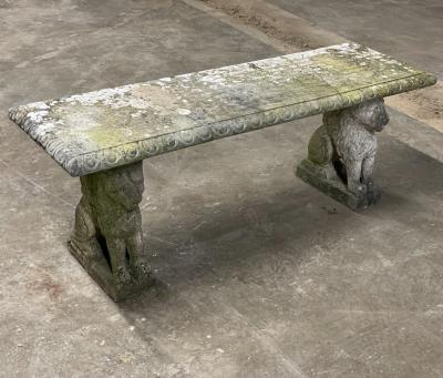 A reconstituted stone bench on