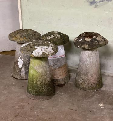 Four staddle stones on circular bases,