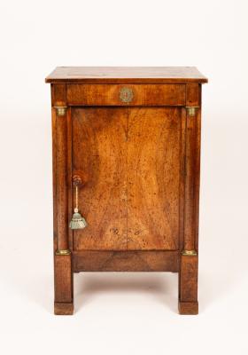 An Empire style plinth cupboard with