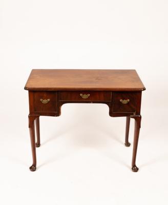 A George III mahogany lowboy, the