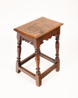A Charles II jointed oak stool,
