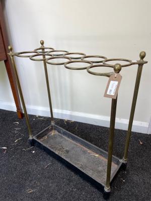 A brass umbrella stand, the top with