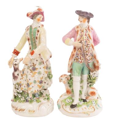 A near pair of Derby figures of hunter