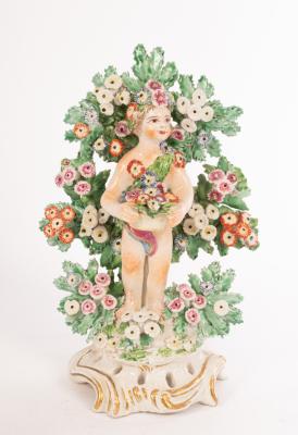 A Bow figure of a cherub with flower