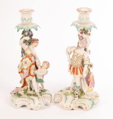 A pair of Derby figural candlesticks,