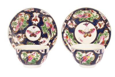 A pair of Worcester tea bowls and saucers,