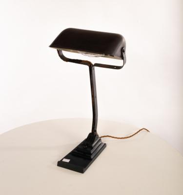 A painted metal desk lamp with