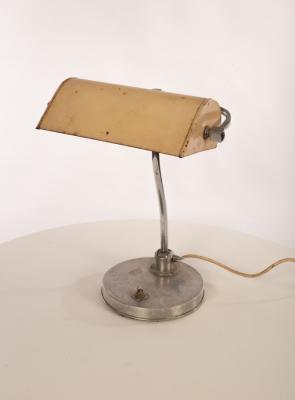 A metal desk lamp, the adjustable shade