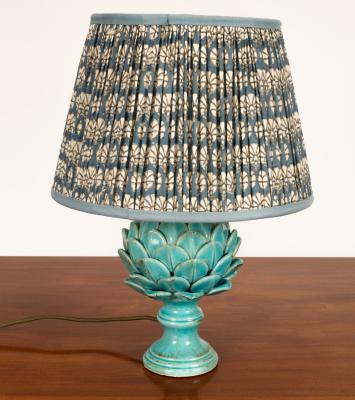 A modern blue ceramic lamp in the