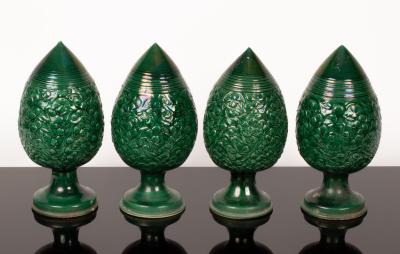 Four green glazed pottery trees, each