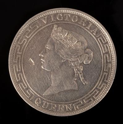 A Hong Kong silver coin with '1868,