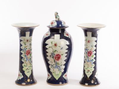 A garniture of three famille rose vases,