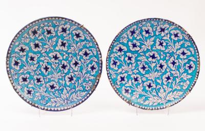 A pair of Iznik style pottery chargers  36bf62