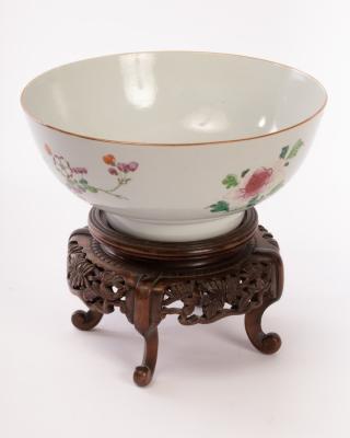 A Chinese export punch bowl on a wooden