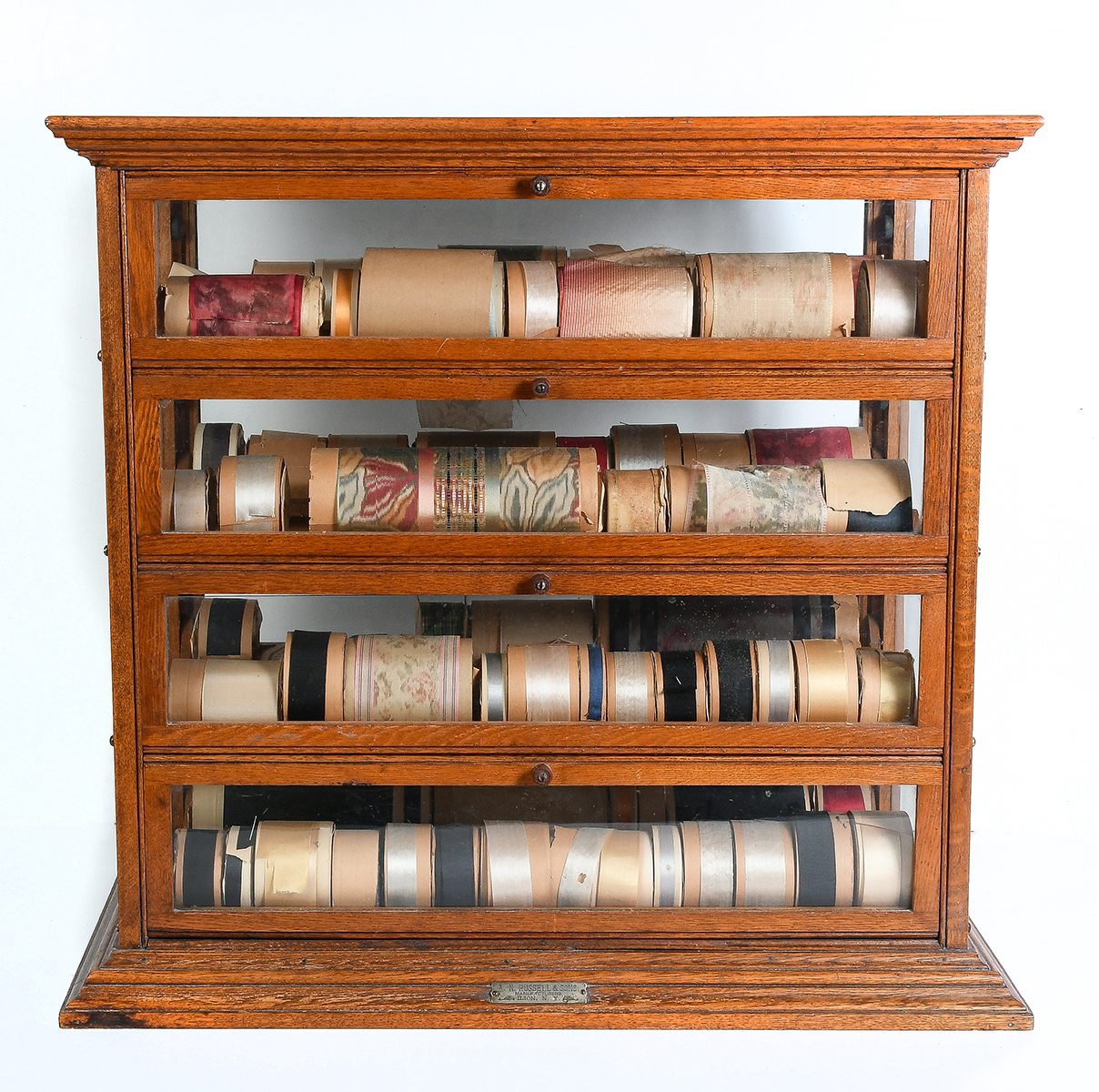 A.N. RUSSELL & SONS RIBBON CABINET: