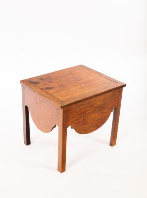 A mahogany table, converted from a commode,