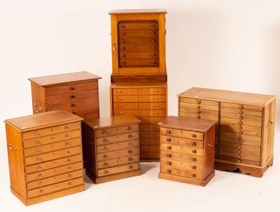 Seven collectors chests in mahogany,