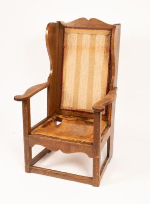 An Arts Crafts oak wingback armchair  36c1ca