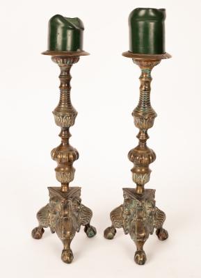 A pair of brass pricket candlesticks,