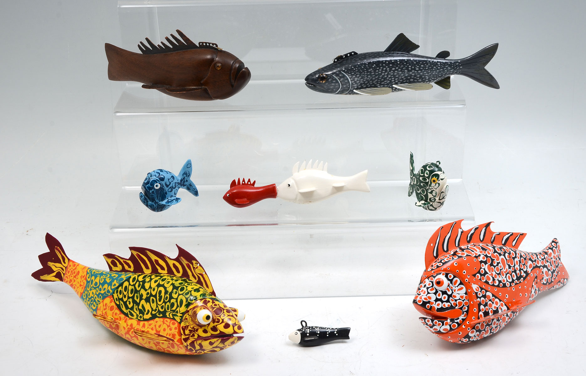 EIGHT HAND-CARVED AND PAINTED FISH
