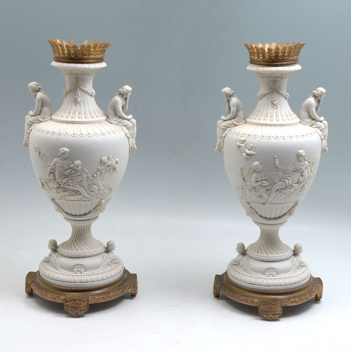 PAIR OF PARIAN URNS Having semi nude 36c435