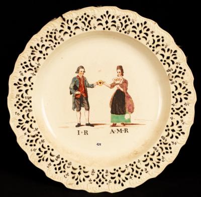 An English creamware marriage plate,