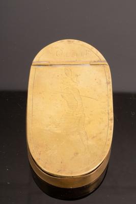 An oval brass tobacco box circa 36c5b5