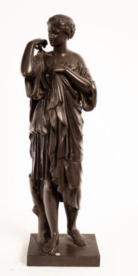 A bronze figure of a Classical female,