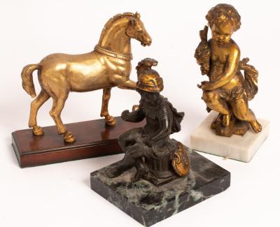 A gilt metal figure of one of the Horses