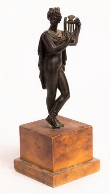 A bronze figure of a Classical youth