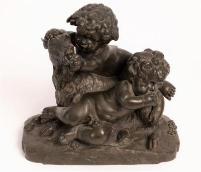 A bronze figure group of the infant