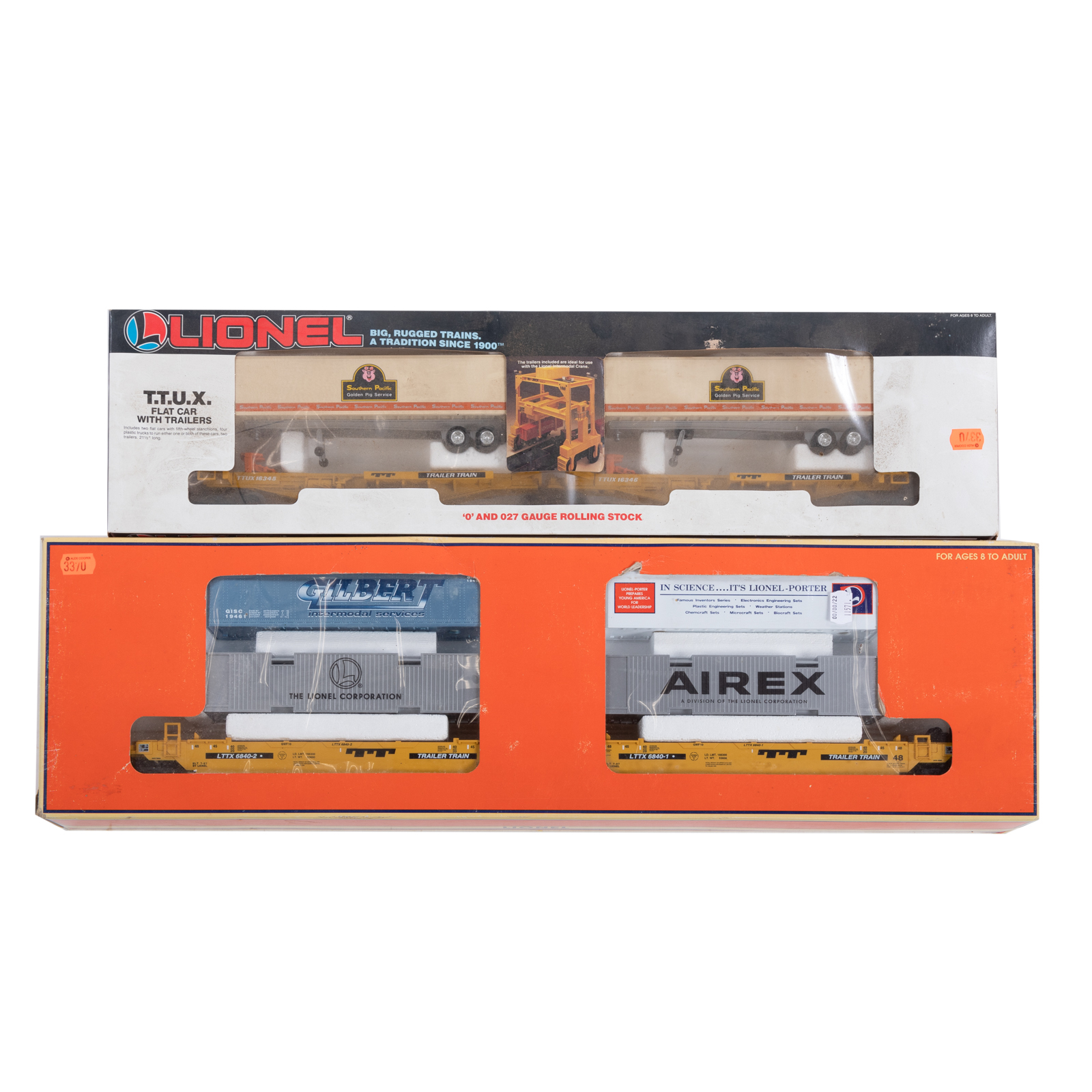 TWO LIONEL FLAT CARS WITH LOADS