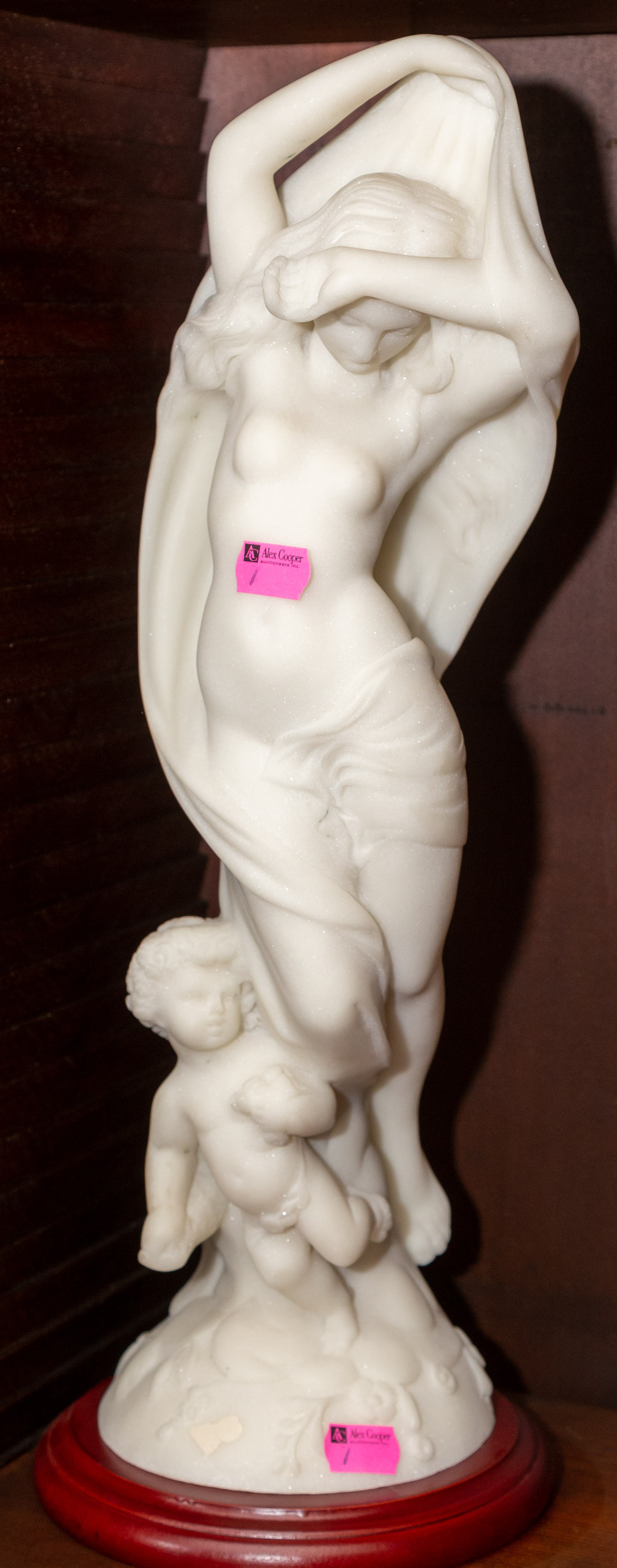 A MARBLE FIGURE OF A GODDESS &