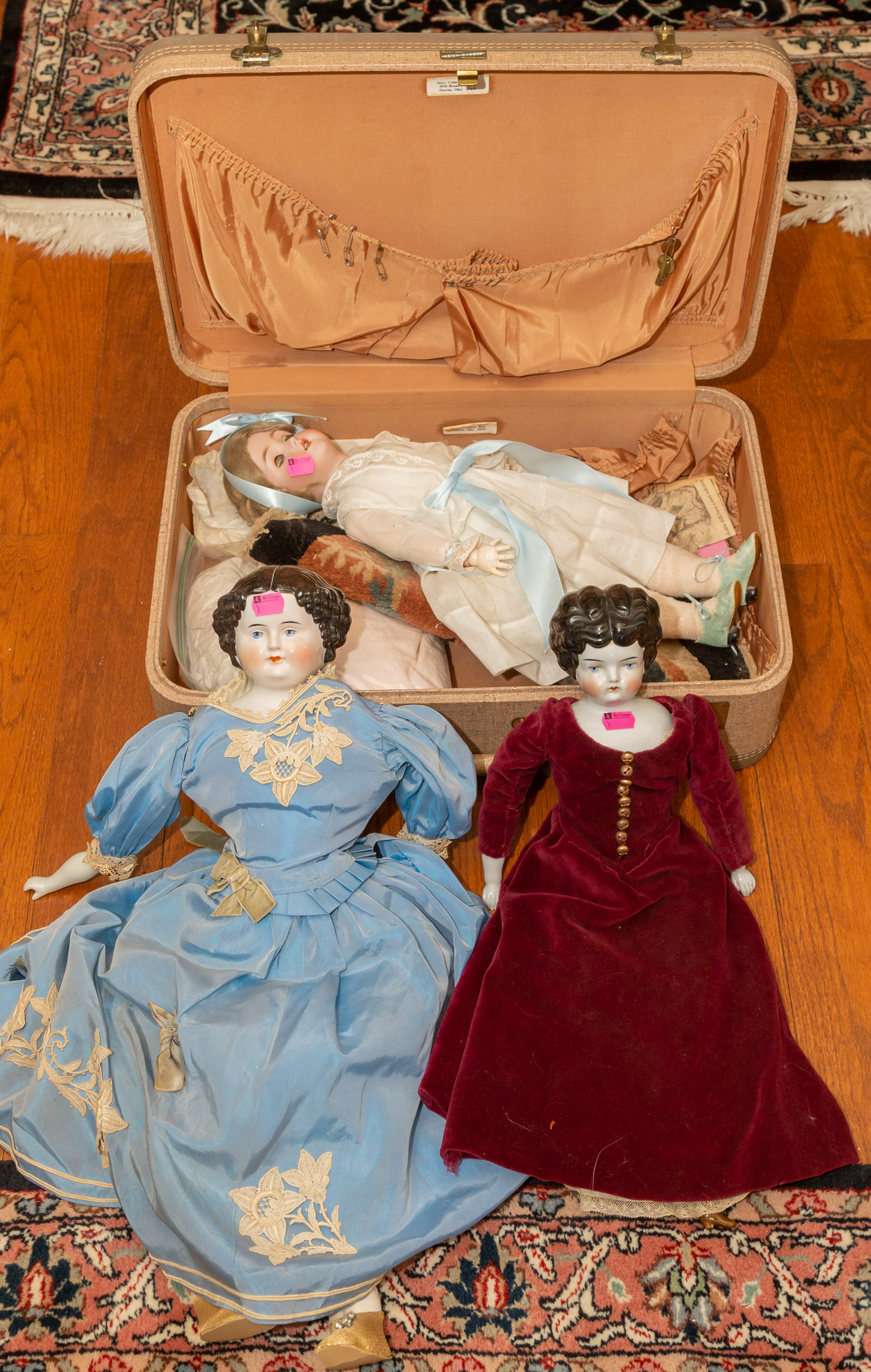 THREE PORCELAIN DOLLS *located in the