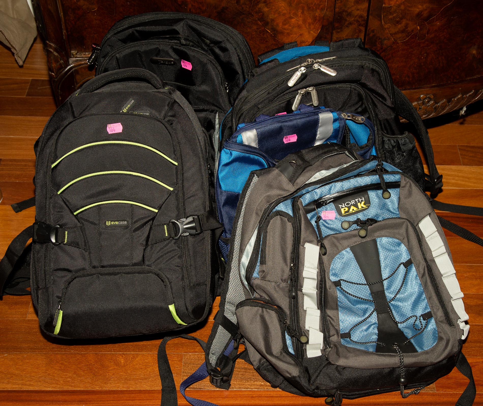 SIX ASSORTED BACKPACKS *located
