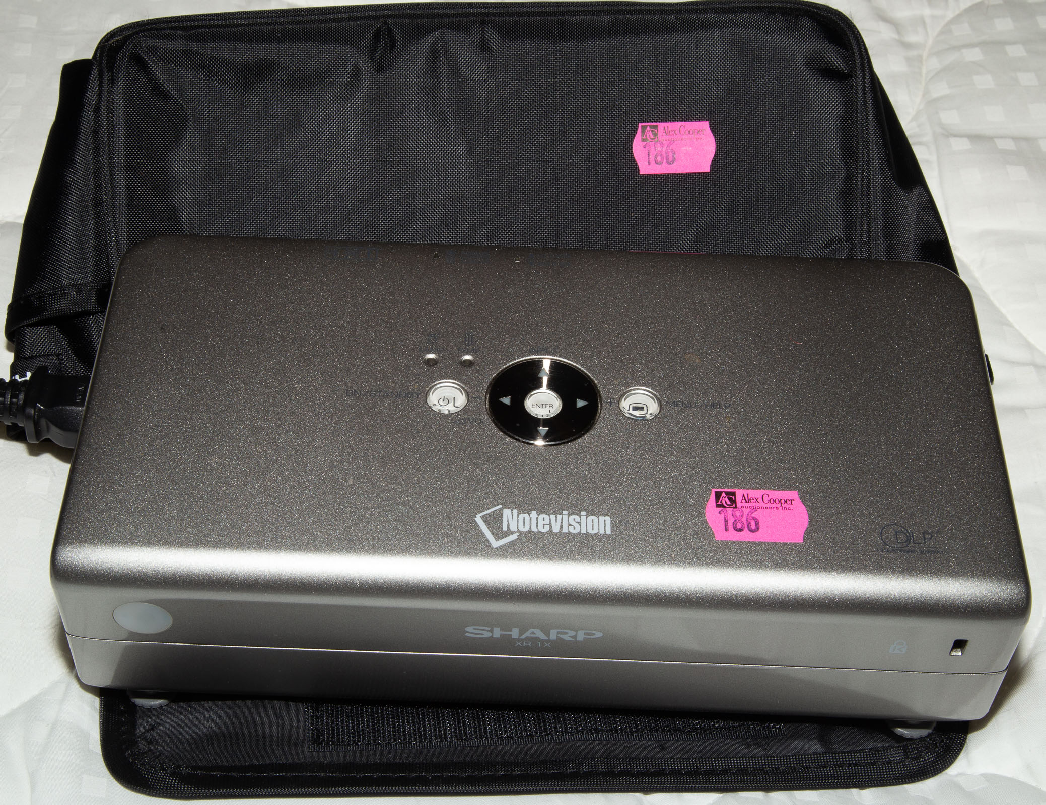 A SHARP XR-1X NOTEVISION PROJECTOR *located