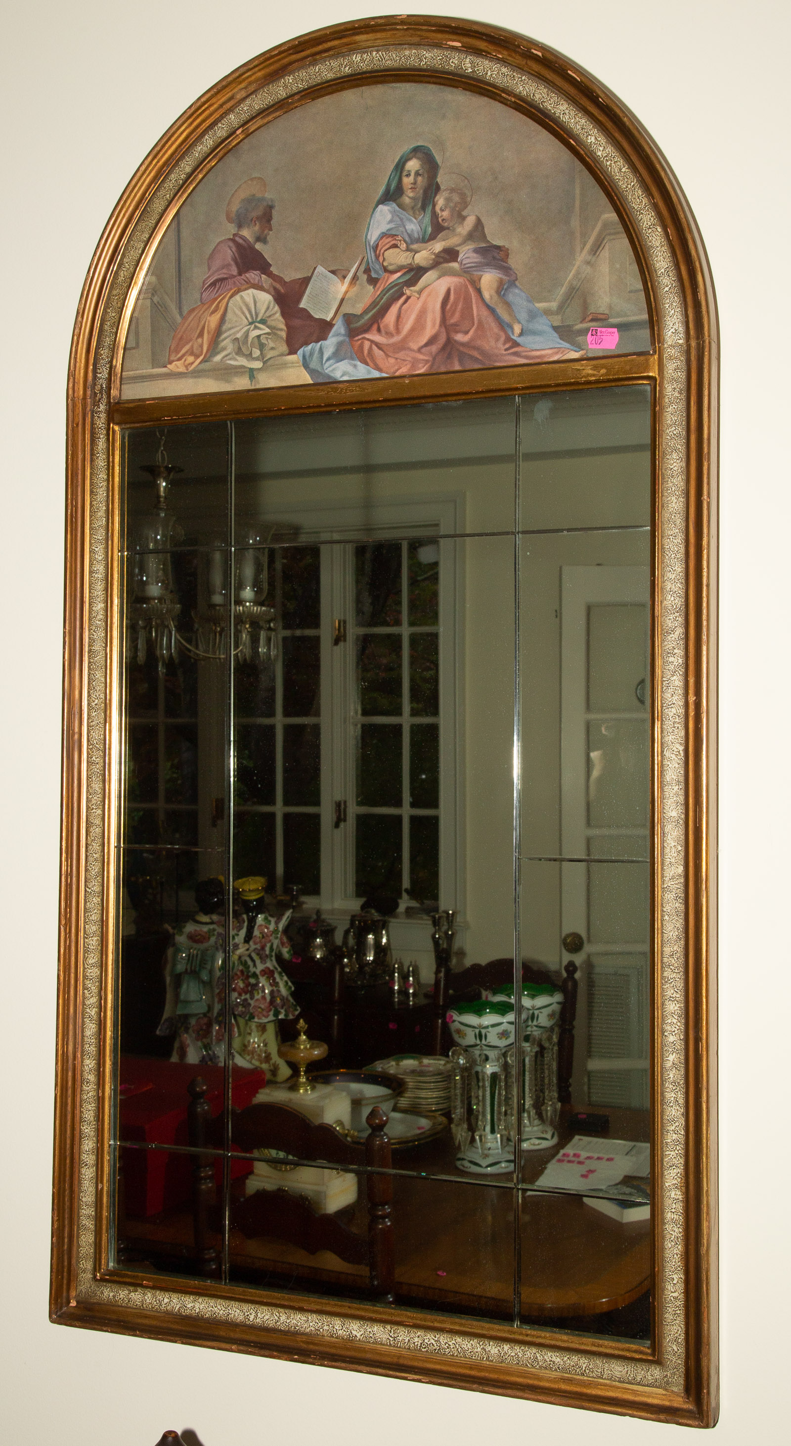 A HAND PAINTED GILT WOOD MIRROR