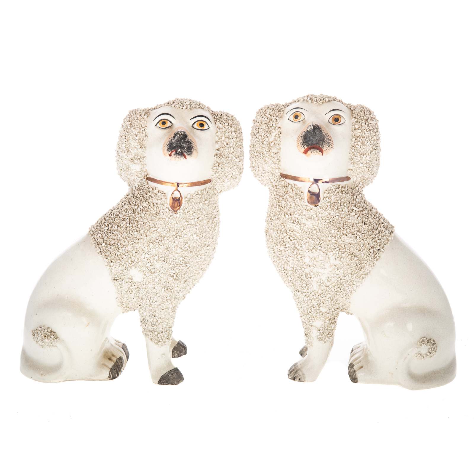 A PAIR OF STAFFORDSHIRE POODLES