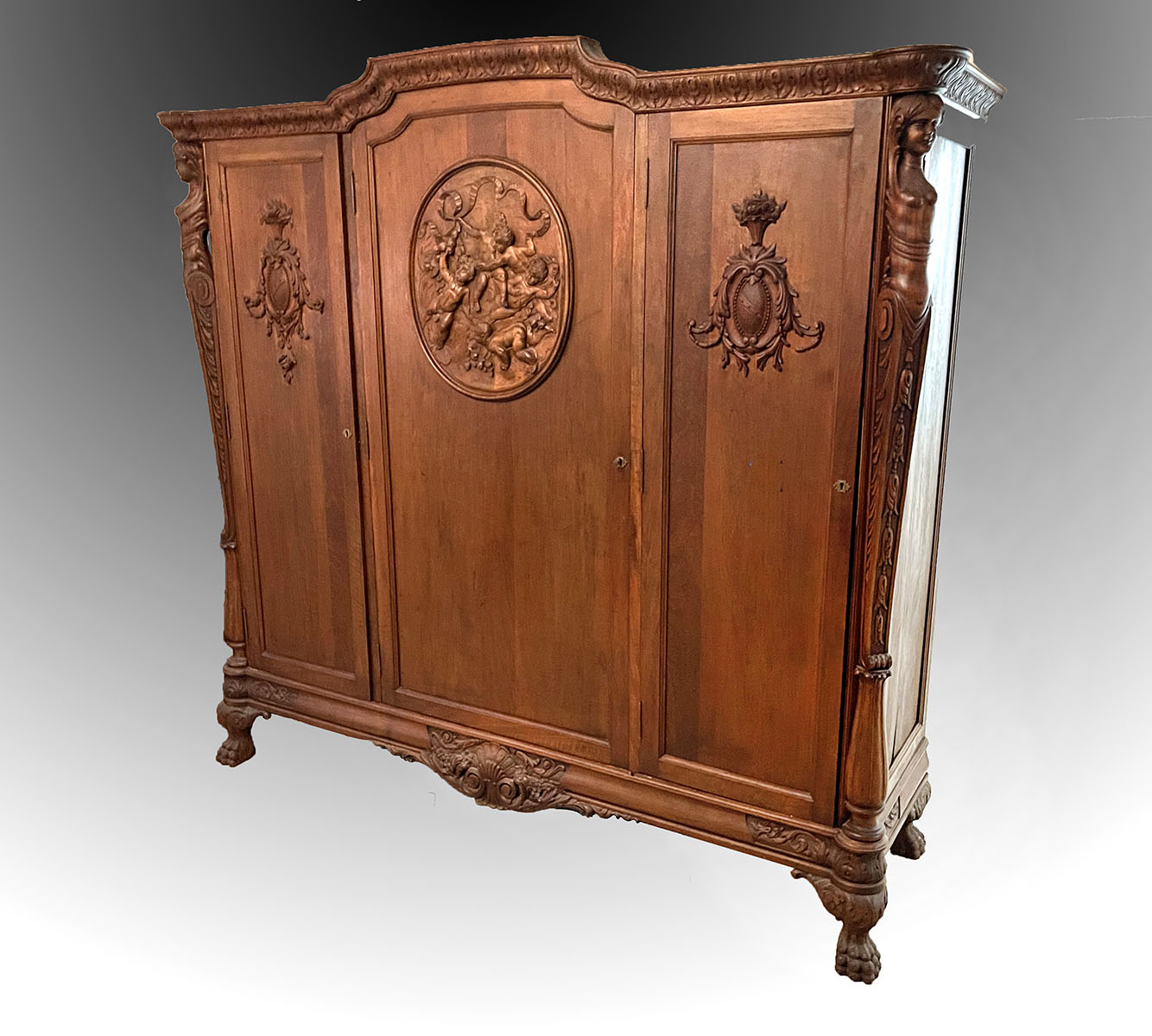 HORNER ERA CARVED ARMOIRE: Surmounting