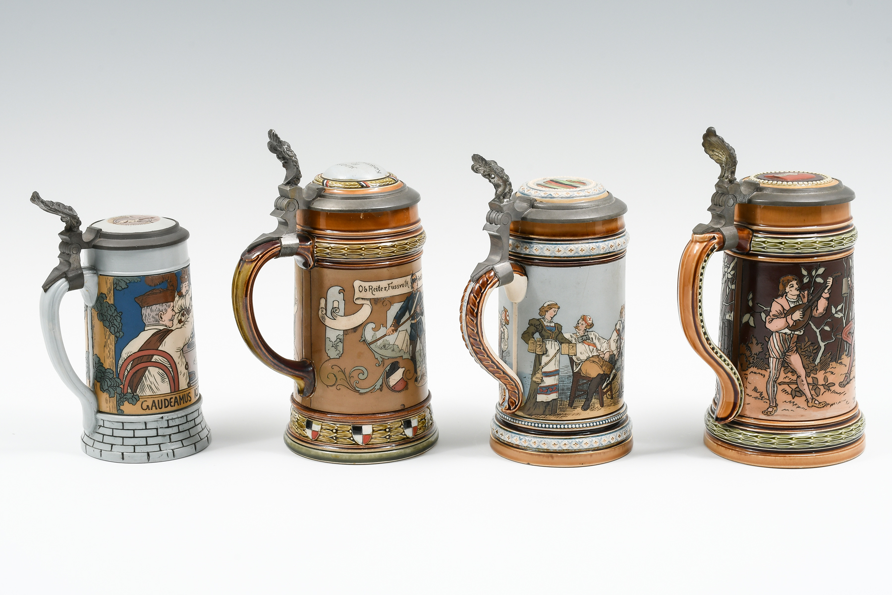 4 PC. METTLACH FIGURAL TAVERN STEINS: