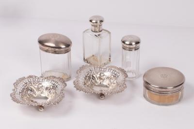 Four silver mounted bottles/jars,