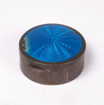 A silver and blue enamel round trinket