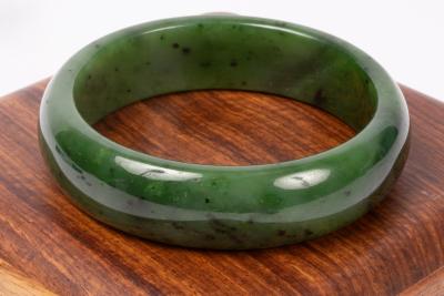 A jade bangle, 63mm inner diameter,