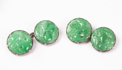 A pair of carved jade cufflinks,