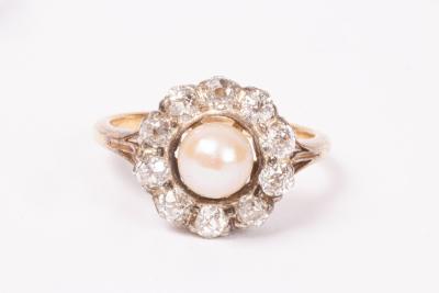 A pearl and diamond cluster ring,