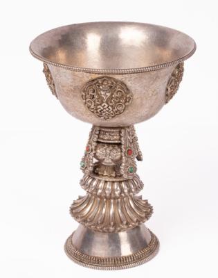 A Tibetan white metal butter lamp, the