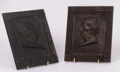 Two early 20th Century cast plaques,